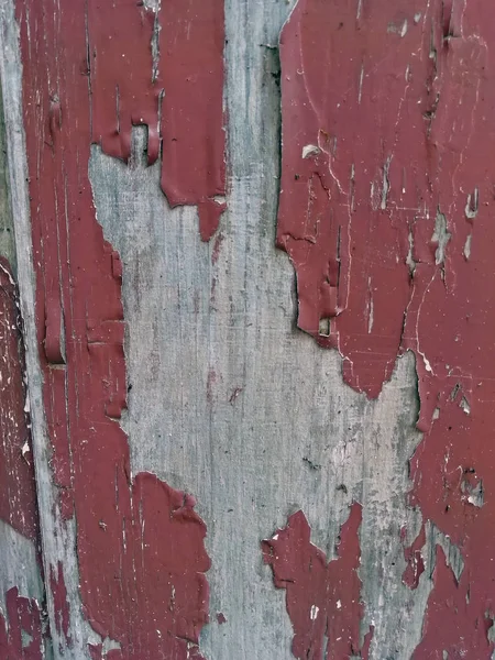 paint peeling off the wooden door