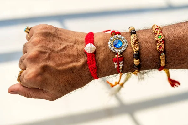 Top View Of A Man 's Hand Covered With Rakhi — стоковое фото