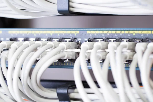 Fast Gigabit Ethnernet network switch in datacenter — Stock Photo, Image