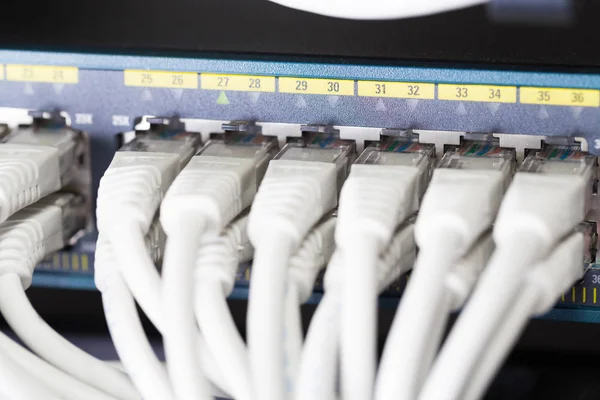 Fast Gigabit Ethnernet network switch in datacenter — Stock Photo, Image