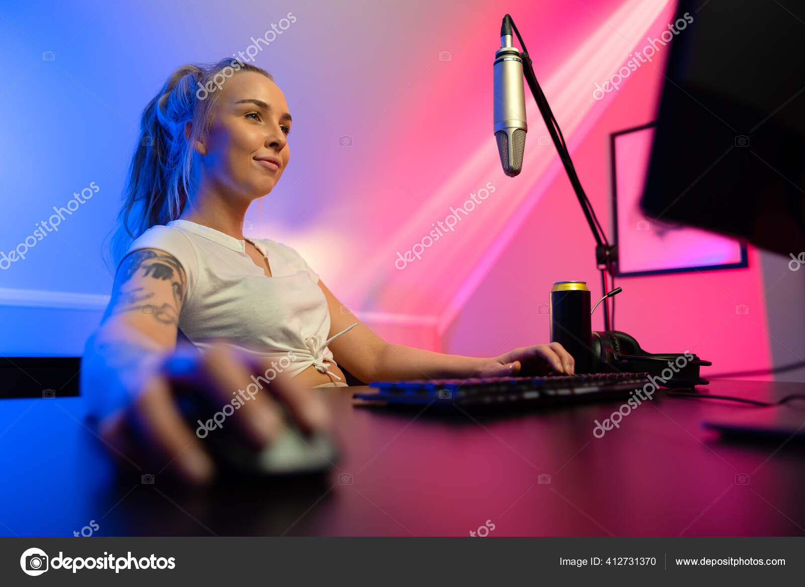 Happy and Beautiful Blonde Gamer Girl Playing Online Video Game on Her  Personal Computer Stock Photo by kjekol