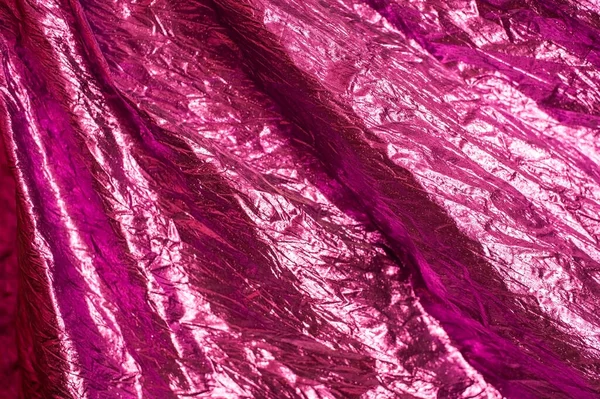Güzel pembe, menekşe renginde modern bir arka plan. Kumaşın ışığı parlıyor. Yatay
