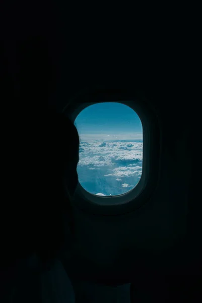 Cloudy sky seen from the window of a plane — Stock Photo, Image