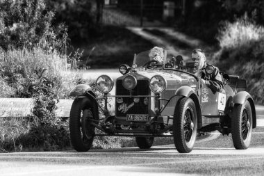 PESARO COLLE SAN BARTOLO , ITALY - MAY 17 - 2018 : ALFA ROMEO 6C 1500 SUPER SPORT MM 1928 on an old racing car in rally Mille Miglia 2018 the famous italian historical race (1927-1957) clipart