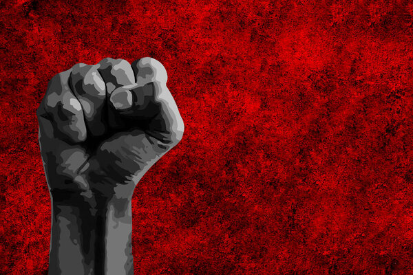 Black fist raised with a powerful anti-racist message calling for freedom and equality with copy space.