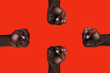 Powerful african black fists raised calling for freedom and equality on a red background. clipart