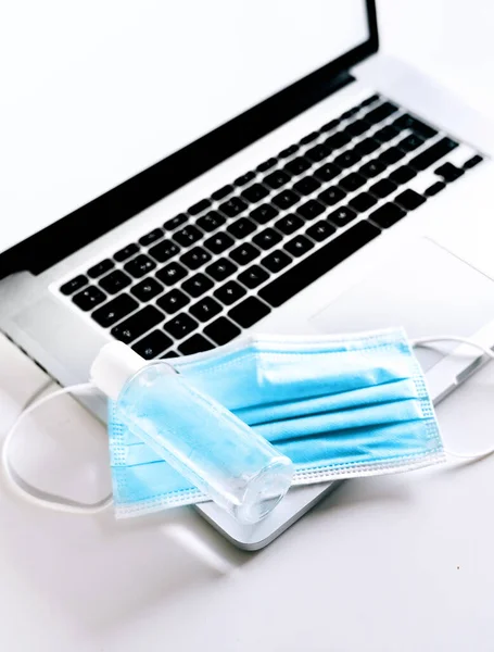 Medical Face Mask Hand Sanitizer Bottle Top Laptop Computer Teleworking — Stock Photo, Image