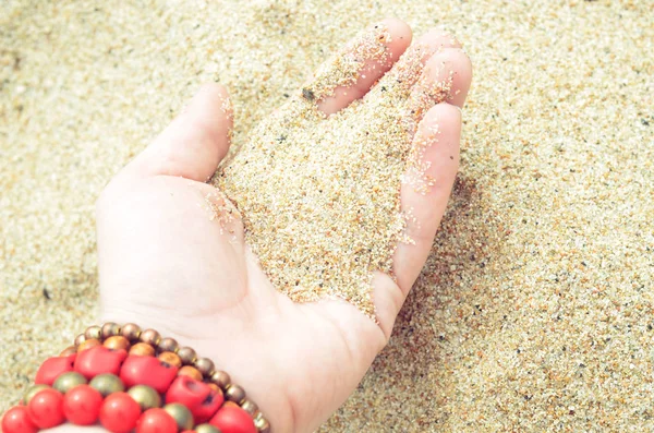 the sand in the hand