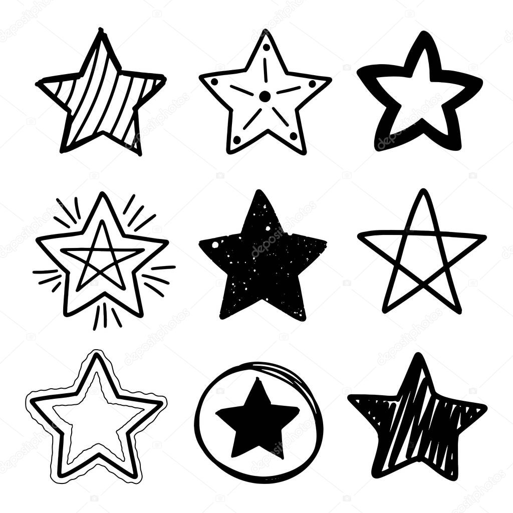 Set of black hand drawn doodle stars in isolated on white background. 