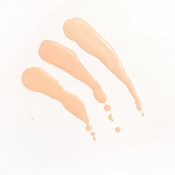 Foundation cream drops and smears of different shades for different skin types. Cosmetics and make-up