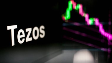 Tezos Cryptocurrency jetonu. Kripto para değişimlerinin davranışı, kavram. Modern finansal teknolojiler.