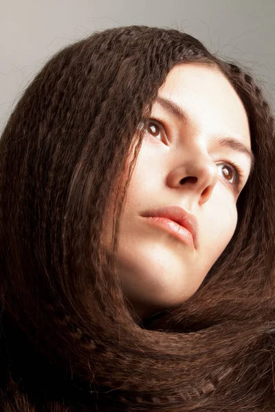 Beautiful long-haired young woman has a dream — Stock Photo, Image