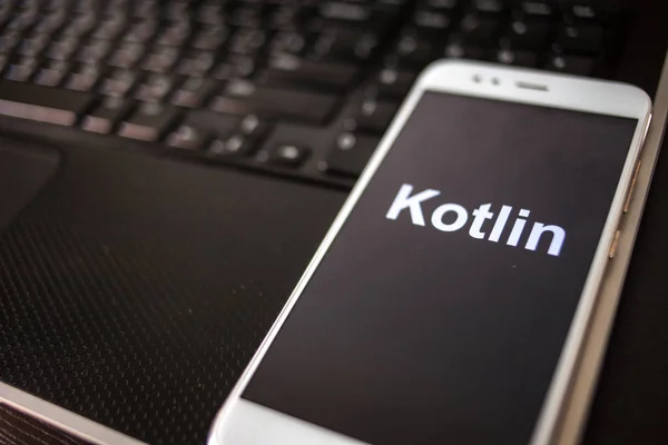 Kotlin Programming language for mobile development, concept. Smartphone