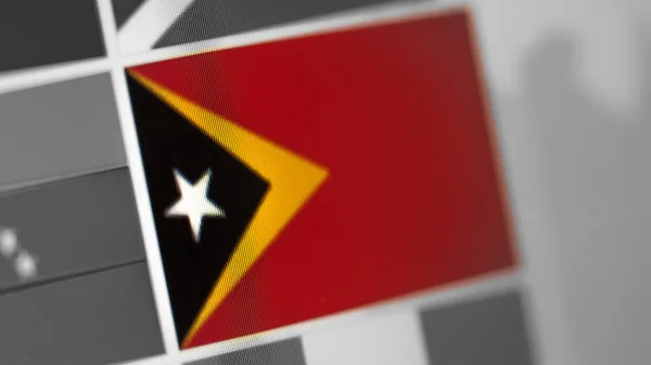 Εθνική σημαία του Ανατολικού Τιμόρ. Η σημαία του Ανατολικού Τιμόρ στην οθόνη, ένα ψηφιακό εφέ. — Φωτογραφία Αρχείου