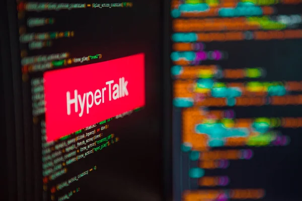 Programmeringsspråk, Hyper Talk inskription på bakgrunden av datorkod. — Stockfoto