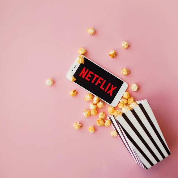 SAINT PETERSBURG, RUSSIA - JULY 7, 2019: Movies and series by subscription, concept. smartphone with Netflix logo — Stock Photo, Image
