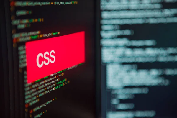 Programmeringsspråk, CSS inskription på bakgrunden av datorkod. — Stockfoto