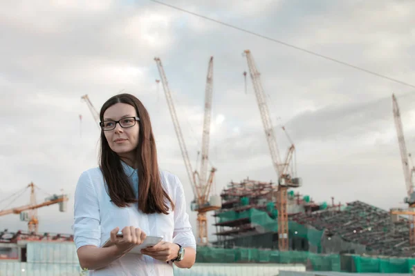 architect on the construction site makes supervision. Young woman engineer or a businessman