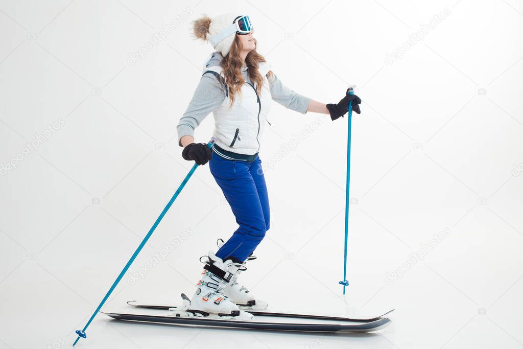 Skier maneuvers on mountain skis, photos on a white background in the Studio,