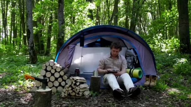 Backpacker Uses Tablet Outdoors Spring Green Forest — Stock Video