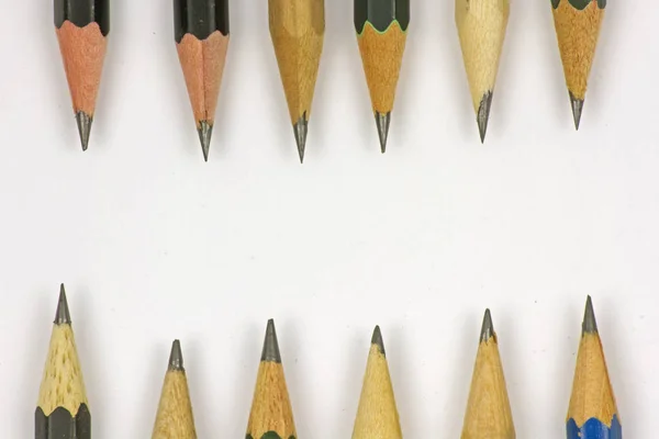 Pencil with sharpening on white paper background. — Stock Photo, Image