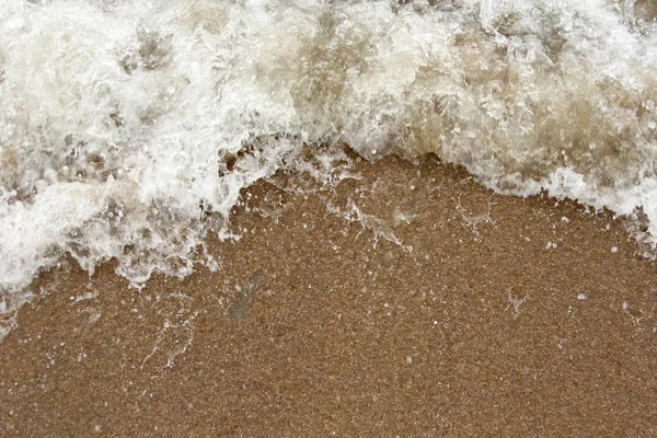 Onda e areia na praia — Fotografia de Stock
