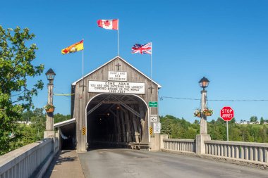 Entrance to the longest covered bridge of the World in Hartland, Canada clipart