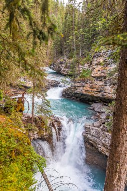 View at the Johnston creek in Johnston Canyon of Banff National Park in Canadian Rocky Mountains, Canada clipart