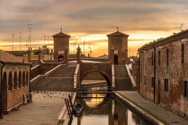 Morning view at the Trepponti bridge in Comacchio, Italy clipart