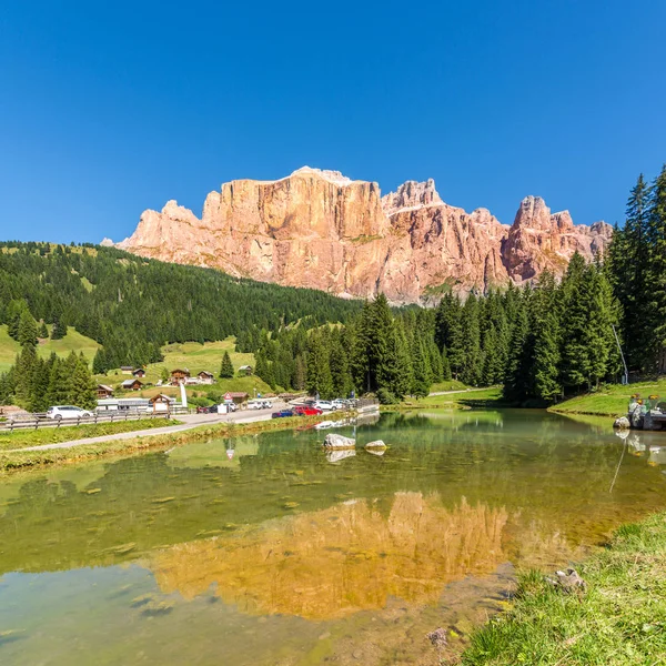 Pond with Torri del Sella mountain in background at the road to Canazei - Italy — Stock Photo, Image