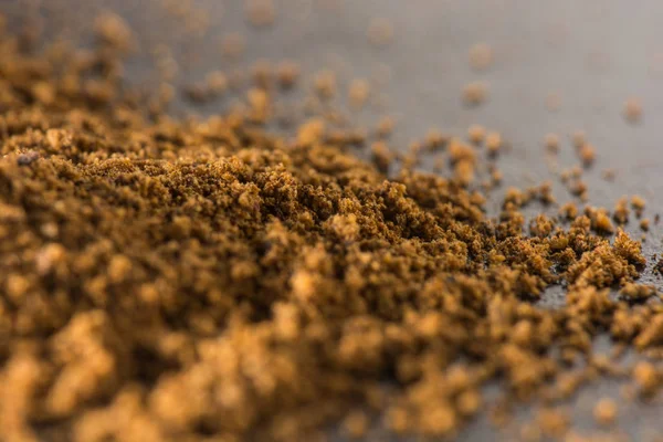 Closeup of cinnamon powder, food background