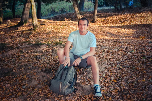 Portrait of young man in park at daytime