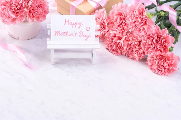 Design concept - Beautiful bunch of carnations on marble white background, top view, copy space, close up, mock up. Mothers day gift idea inspiration. — Stock Photo, Image