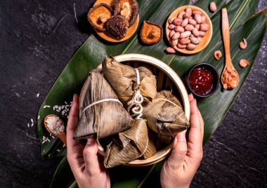Zongzi, delicious fresh hot steamed rice dumplings in steamer. Close up, copy space, famous asian tasty food in dragon boat duanwu festival