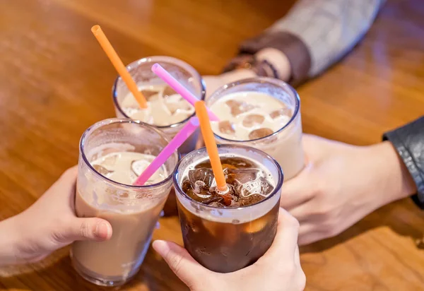 Party concept, girl with friends hold coffee cups and say cheers happy hangout together in cafe, lifestyle, copy space, top view, close up