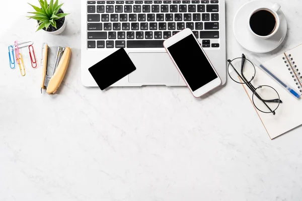 Online purchase concept, mock up credit card with fashion office desk computer isolated on beautiful marble background, workspace design, topview, flatlay, copyspace, closeup