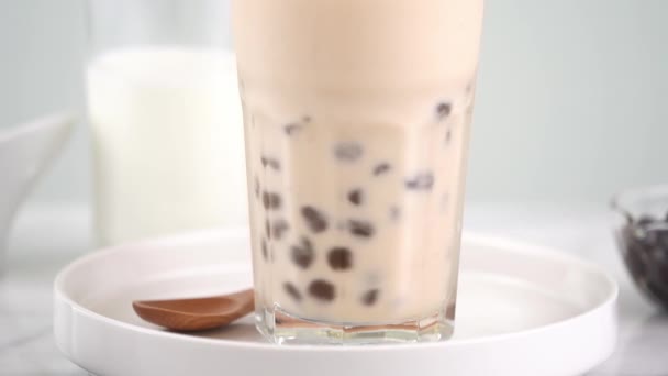 Slow Motion Stirring Tapioca Pearl Bubble Milk Tea Drinking Glass — Stock Video