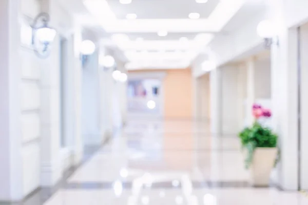 Luxury department store shopping mall interior, abstract defocused blur with bokeh background, concept of shopping seasons design.