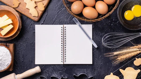 Making cookies cookbook recipe design concept, baking ingredients preparation layout with notebook, top view, flat lay, overhead, mockup copy space.