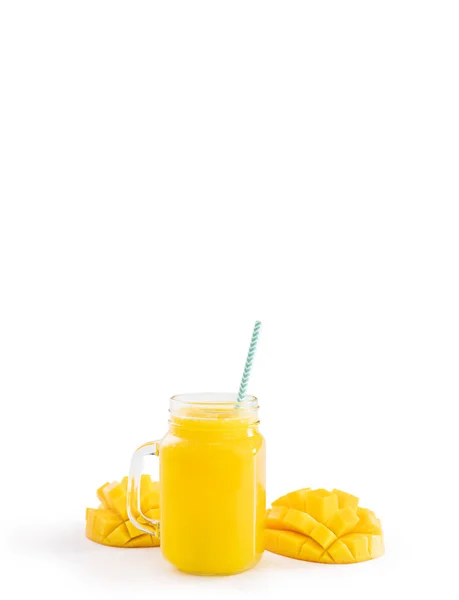 Fresh tropical mango juice with beautiful diced pulp and striped paper straw isolated on white background table, close up, cut out, clipping path. — Stock Photo, Image