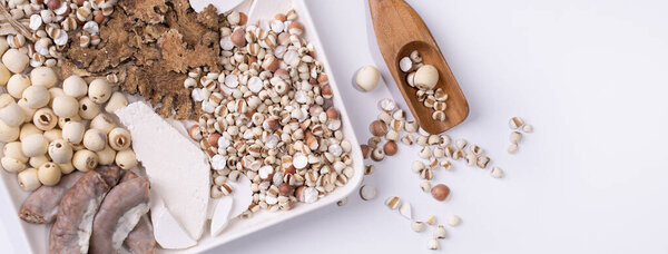 Ingredients of Four Tonics Soup, Four Herb Flavor Soup. Taiwanese traditional food with Job's tears, herbs, pork intestines on white background