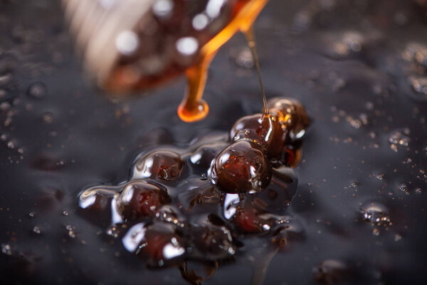 Cooking, boiling brown sugar flavor tapioca pearl balls, ingredient of bubble tea, preparing food and drink, close up, recipe cookbook steps design concept.