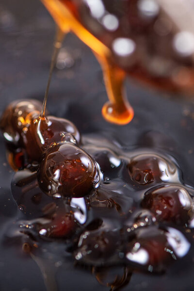 Cooking, boiling brown sugar flavor tapioca pearl balls, ingredient of bubble tea, preparing food and drink, close up, recipe cookbook steps design concept.