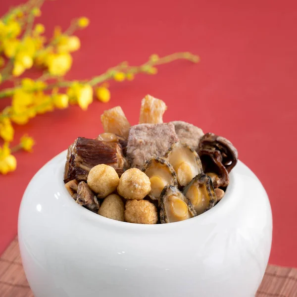 Traditional food of Chinese lunar new year, Buddha jumps over the wall, Chinese Soup Casserole dish, Buddha's Temptation, named Fo Tiao Qiang, close up.