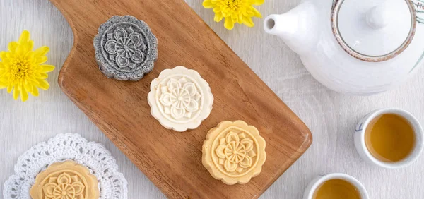 Colorful beautiful moon cake, mung bean cake, Champion Scholar Pastry cake for Mid-Autumn festival traditional gourmet dessert snack, top view, flat lay.