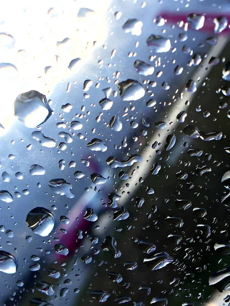 Rain drops on car window. Condensation bubble image closeup. Macro photo. Abstract Background, Water Texture for Your Design.