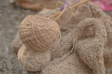 Brown ball (Hemp filament) of yarn.
