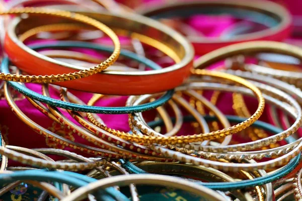 Indian bracelets on beautiful shawl. Indian fashion