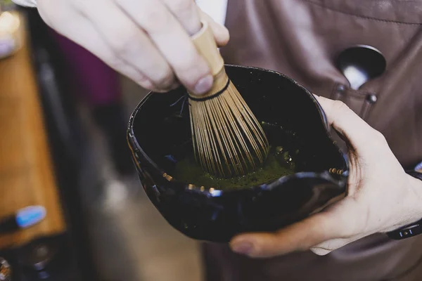 Japanese tea ceremony, Matcha tea prepared with bamboo whisk. Matcha, traditional culture concept. Japanese matcha