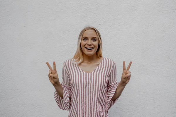 Smiling Attractive Blonde Woman Showing Peace Gestures Grey Wall Street — Stock Photo, Image